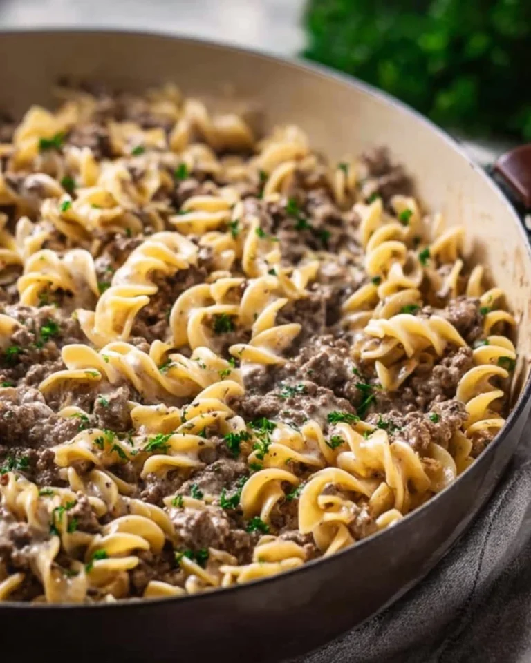 Delicious plate of Ground Beef Stroganoff served with pasta and fresh herbs